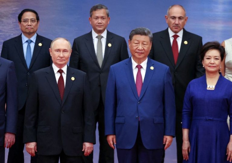 China's Xi Pushes A New Global Order, Flanked By Leaders Of Russia And India